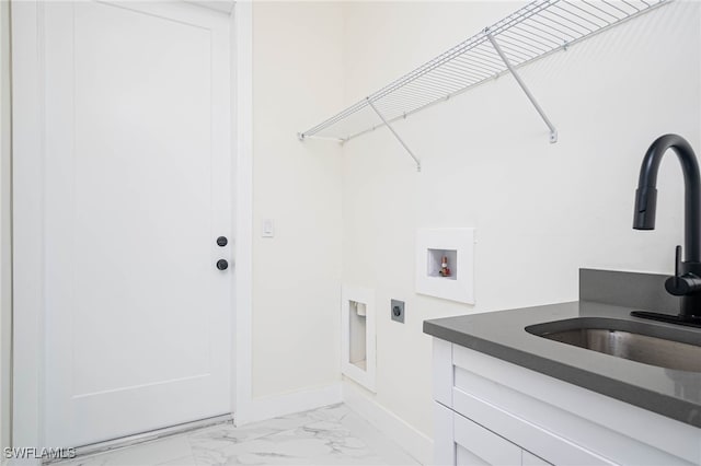 1949 Mariano St, Lehigh Acres, FL 33972 - laundry room featuring cabinet space, electric dryer hookup, washer hookup, light marble finish floors, and baseboards