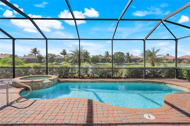 view of pool featuring an in ground hot tub, a patio, a lanai, and a water view