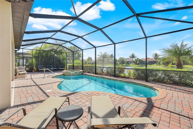 view of pool featuring a patio area, an in ground hot tub, and glass enclosure