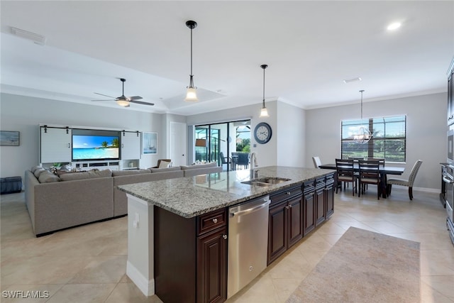 kitchen with sink, dishwasher, dark brown cabinetry, pendant lighting, and a kitchen island with sink