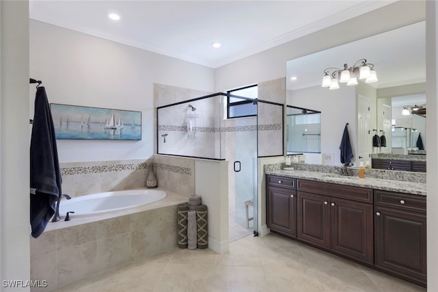 bathroom with vanity, ornamental molding, separate shower and tub, and tile patterned flooring