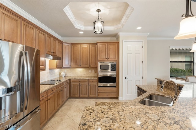 kitchen with ornamental molding, hanging light fixtures, stainless steel appliances, and sink