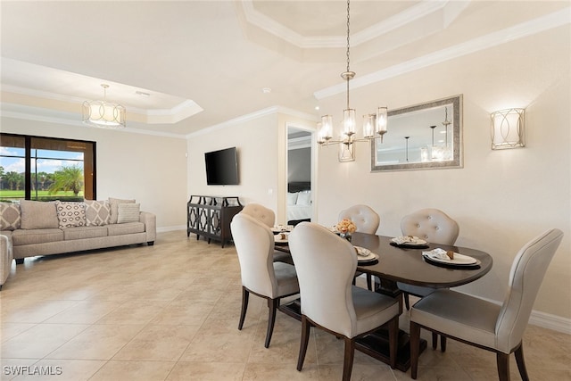 tiled dining space with crown molding, an inviting chandelier, and a raised ceiling