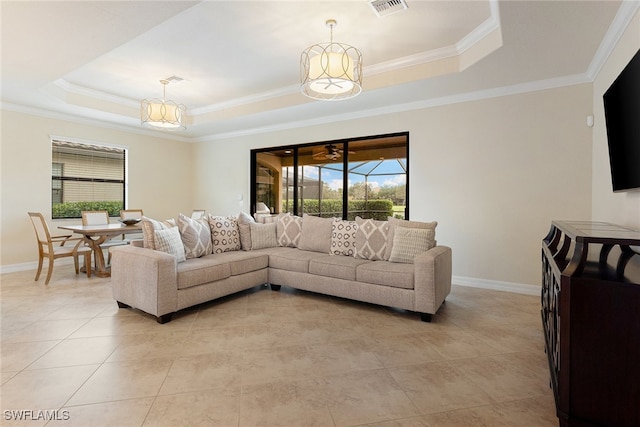 living room with crown molding and a raised ceiling