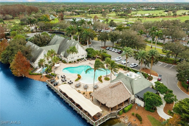 birds eye view of property with a water view