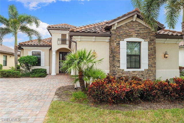 mediterranean / spanish-style house with a balcony