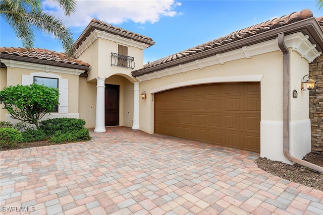 mediterranean / spanish house featuring a garage