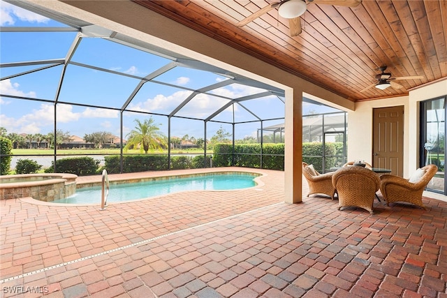 view of pool with a patio, a lanai, an in ground hot tub, and ceiling fan