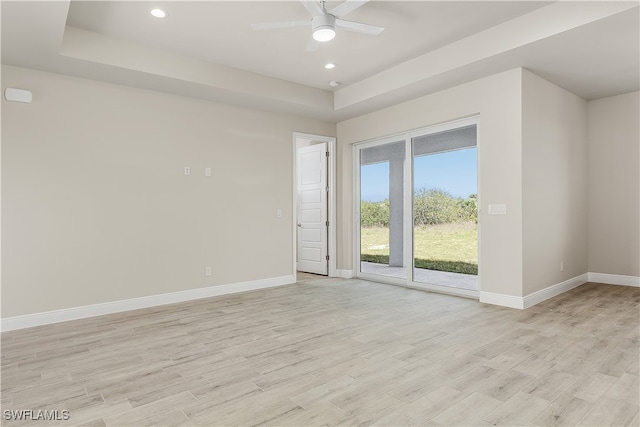 unfurnished room with light hardwood / wood-style flooring and ceiling fan