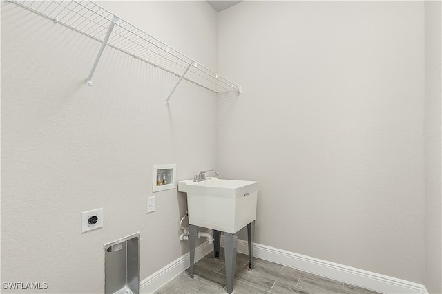 laundry room featuring electric dryer hookup, washer hookup, and hardwood / wood-style floors