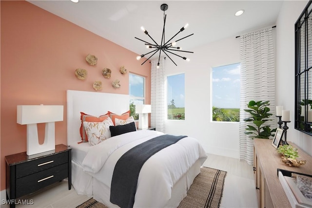 bedroom featuring recessed lighting and an inviting chandelier