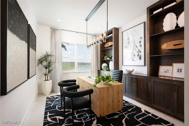 interior space with baseboards and an inviting chandelier