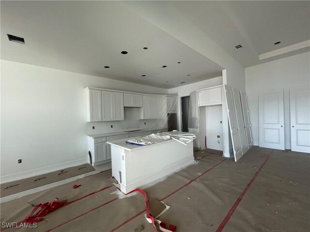 kitchen with a center island and white cabinets