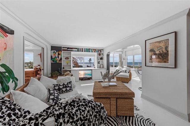 tiled living room with ornamental molding and a healthy amount of sunlight