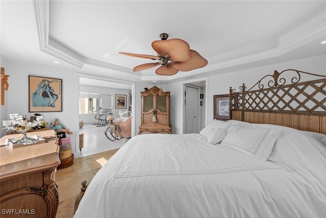 bedroom with ceiling fan, light tile patterned flooring, and a raised ceiling