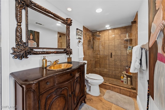 bathroom with vanity, toilet, and walk in shower