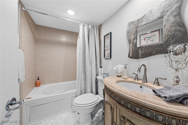 full bathroom featuring vanity, shower / tub combo, and toilet