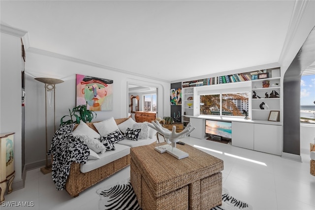 living room featuring ornamental molding and light tile patterned flooring