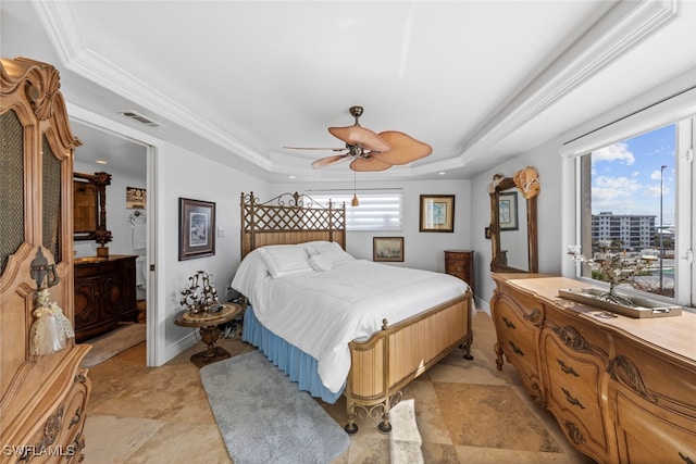 bedroom with ornamental molding, a raised ceiling, multiple windows, and ceiling fan