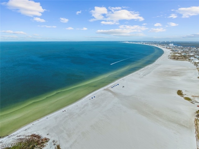 birds eye view of property featuring a view of the beach and a water view