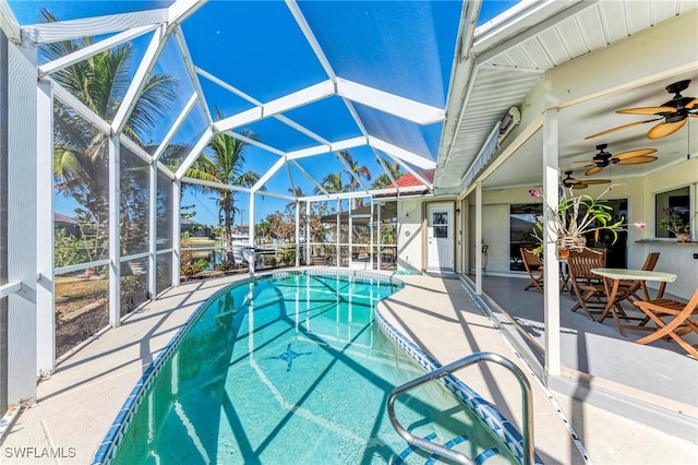 view of pool with a patio area, a lanai, and ceiling fan