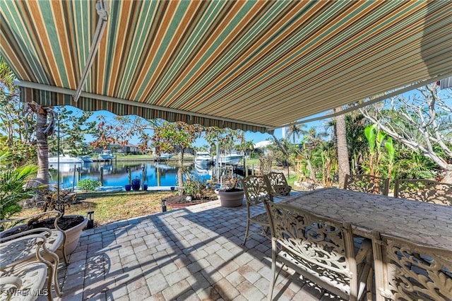 view of patio / terrace with a water view