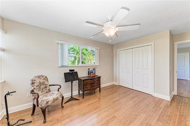 office space featuring light wood-type flooring and ceiling fan