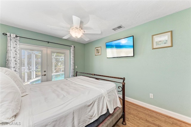 bedroom with french doors, ceiling fan, access to outside, and light hardwood / wood-style floors