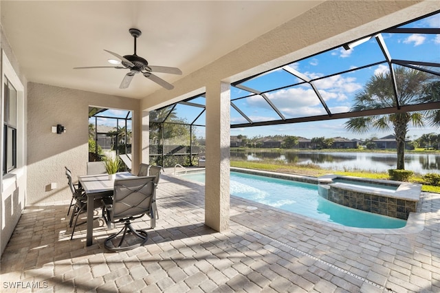 view of swimming pool with a lanai, a water view, an in ground hot tub, and ceiling fan