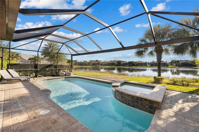 view of pool featuring an in ground hot tub, a water view, glass enclosure, and a patio area