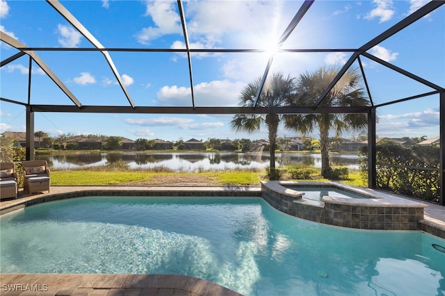 view of pool featuring an in ground hot tub, a water view, and glass enclosure