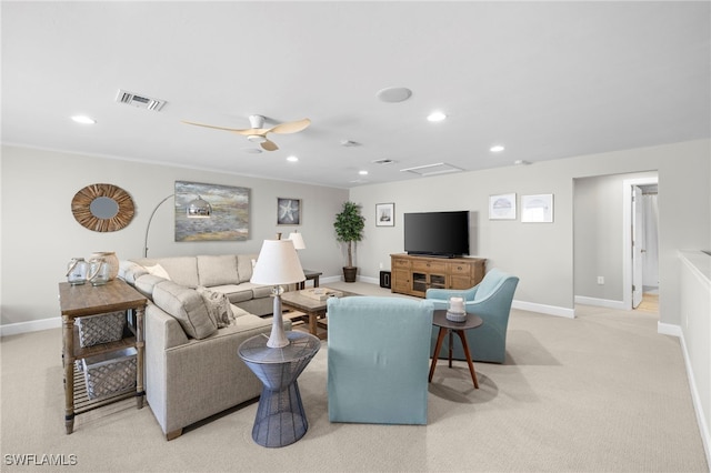 living room featuring light carpet and ceiling fan