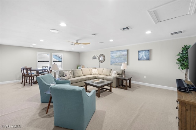 carpeted living room featuring ceiling fan