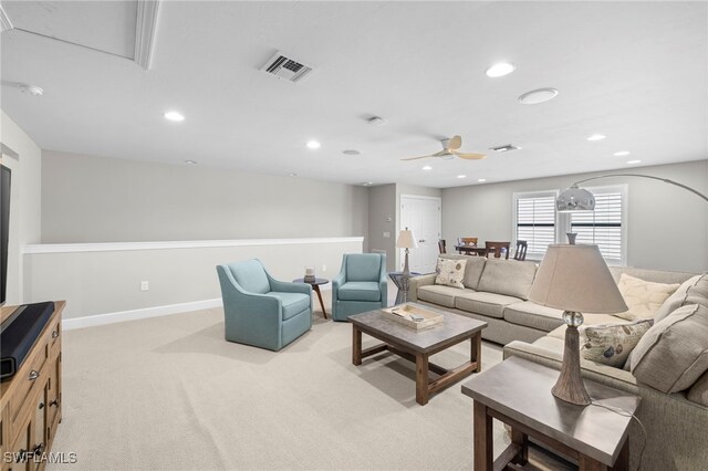 living room with ceiling fan and light carpet