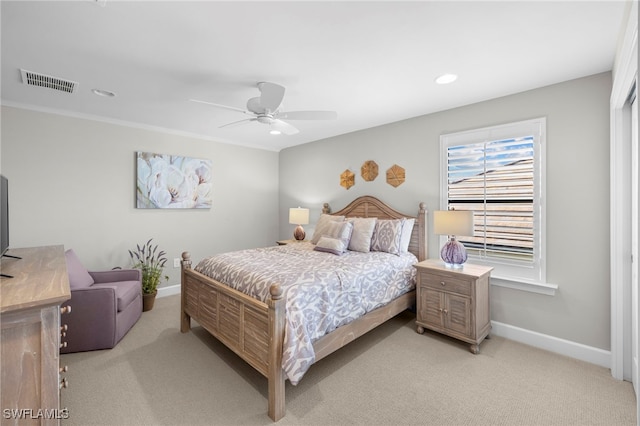 bedroom featuring light colored carpet and ceiling fan