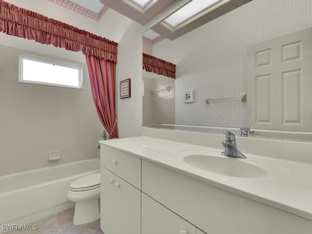 full bathroom with tile patterned floors, vanity, toilet, and shower / tub combo