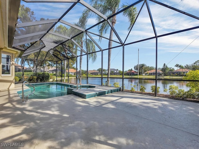 view of swimming pool featuring a patio, a lanai, a jacuzzi, and a water view