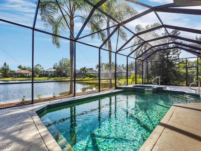 view of pool featuring an in ground hot tub, a patio, a water view, and glass enclosure