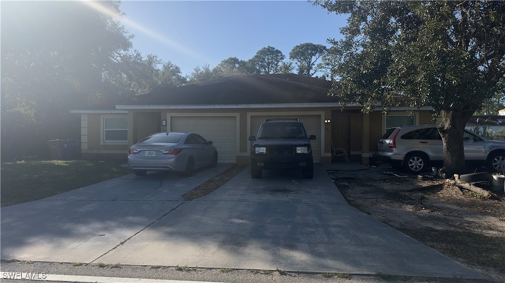 single story home with a garage