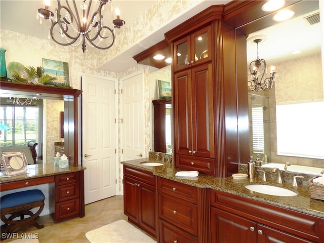 bathroom featuring a washtub, vanity, an inviting chandelier, and tile patterned flooring