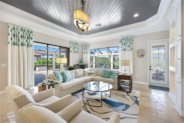 living room with wooden ceiling, a raised ceiling, and ornamental molding