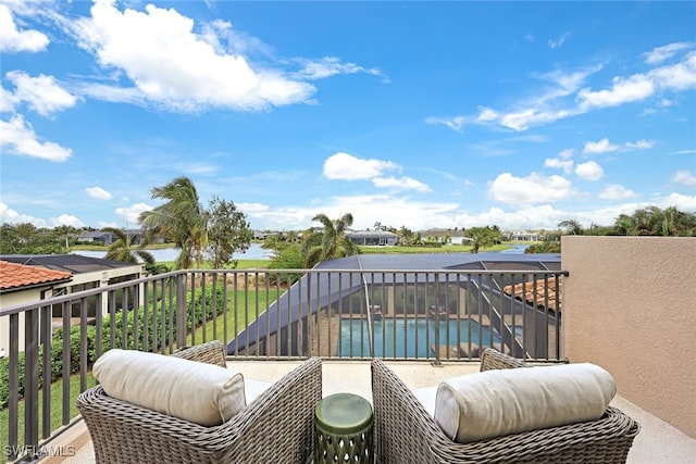 balcony featuring a water view