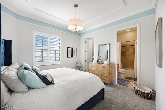 bedroom with carpet flooring, ensuite bathroom, and ornamental molding