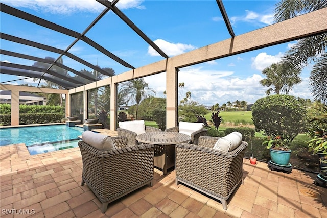 view of swimming pool with a lanai and a patio area