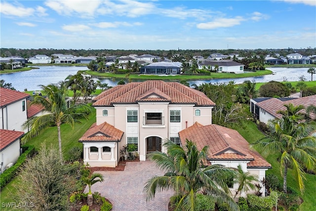 birds eye view of property with a water view