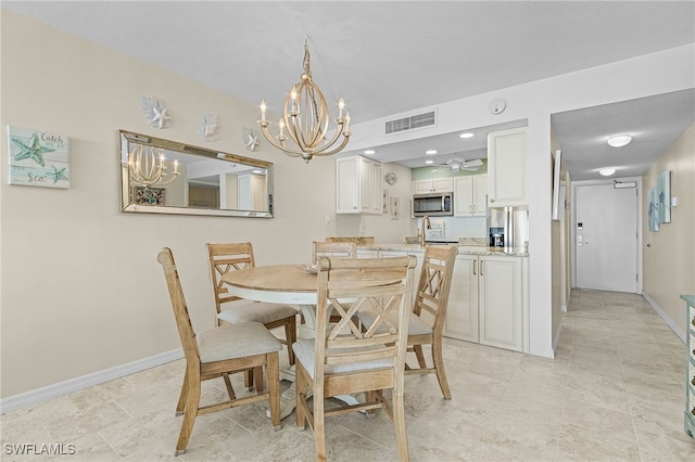 dining area with a chandelier