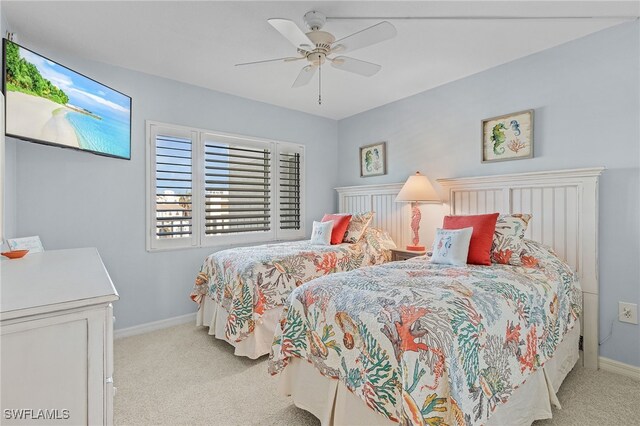 26340 Hickory Blvd Unit 403, Bonita Springs, FL 34134 - bedroom featuring light carpet, baseboards, and a ceiling fan