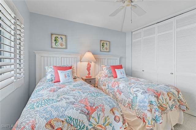 26340 Hickory Blvd Unit 403, Bonita Springs, FL 34134 - bedroom featuring multiple windows, carpet, a closet, and a ceiling fan
