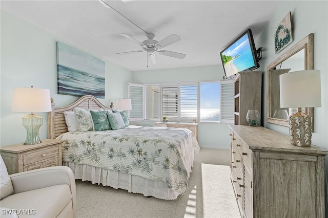 26340 Hickory Blvd Unit 403, Bonita Springs, FL 34134 - bedroom featuring light colored carpet, a ceiling fan, and baseboards
