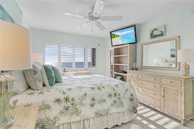 bedroom featuring light colored carpet and ceiling fan